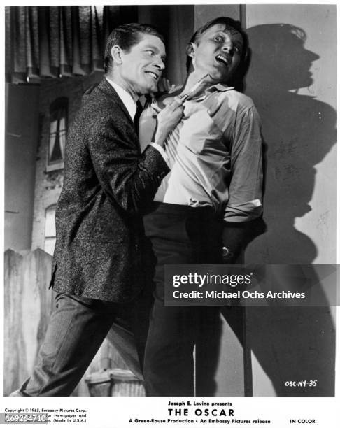 Stephen Boyd threatens a man in a scene from the film 'The Oscar', 1966.