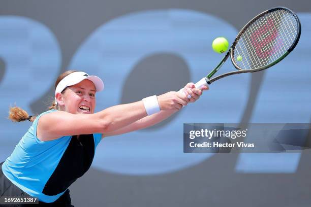 Jelena Ostapenko of Latvia plays a backhand during the women's singles round of 16 match against Sofia Kenin of United States as part of the day six...