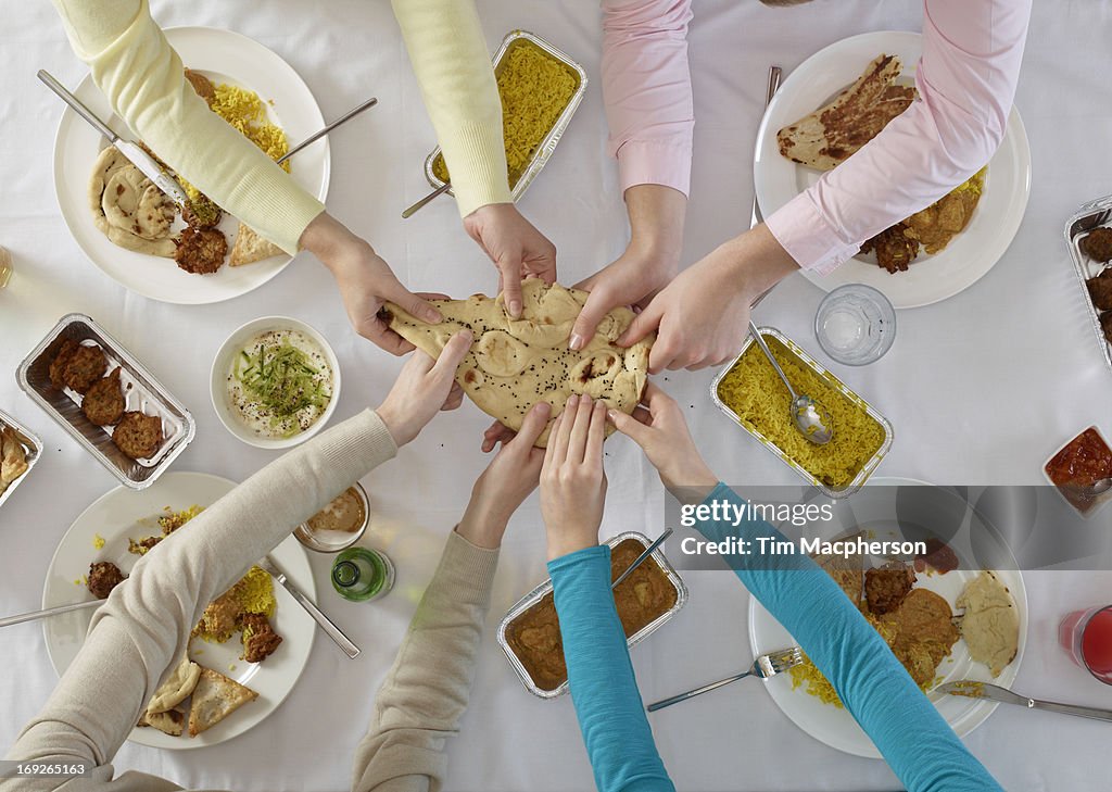 Overhead view of people sharing at table