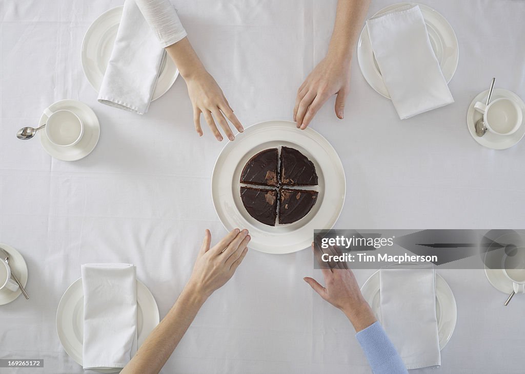 Overhead view of people sharing dessert