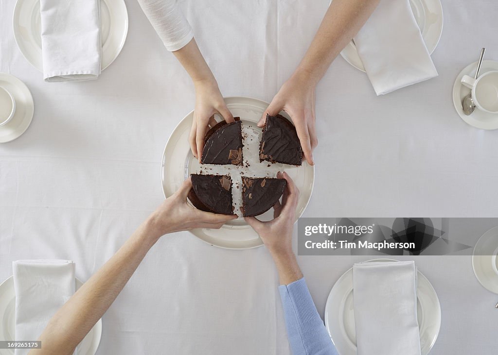 Overhead view of people sharing dessert