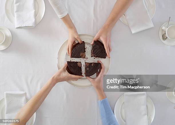overhead view of people sharing dessert - four people stock pictures, royalty-free photos & images