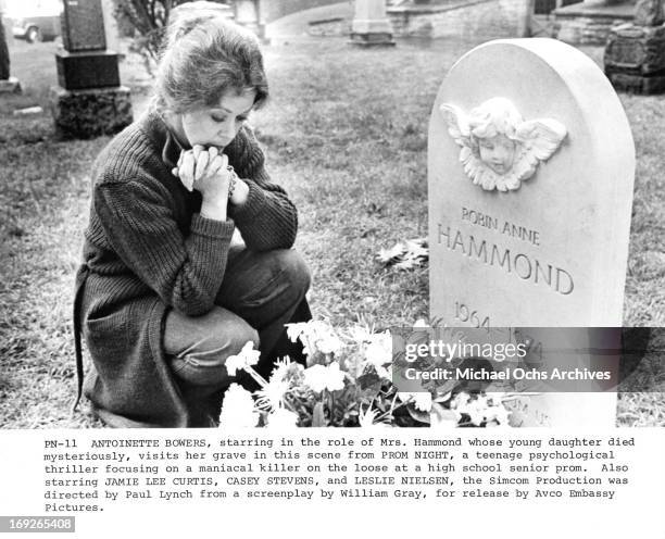 Antoinette Bower visits the grave of her daughter in a scene from the film 'Prom Night', 1980.