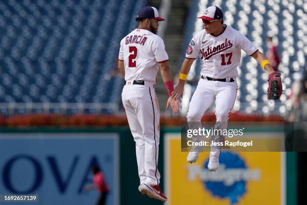 Luis Garcia of the Washington Nationals and Alex Call celebrate after winning against the Chicago White Sox at Nationals Park on September 20, 2023...