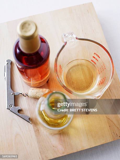 board with wine, oil and corkscrew - vinaigrette dressing imagens e fotografias de stock