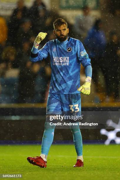 Bartosz Bialkowski of Millwall celebrates after team-mate Zian Flemming scored the team's second goal during the Sky Bet Championship match between...