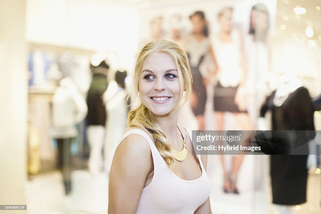 Smiling woman shopping in mall