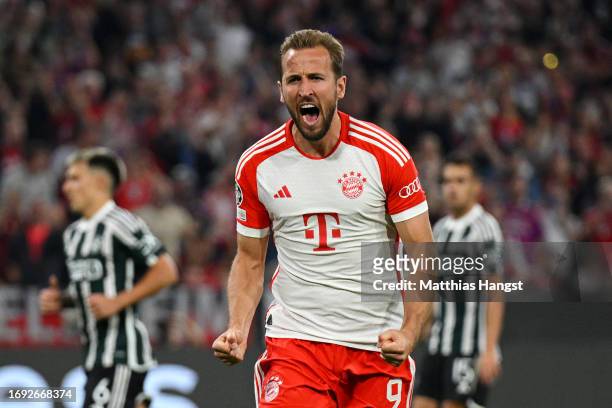 Harry Kane of Bayern Munich celebrates after scoring their sides third goal from the penalty spot during the UEFA Champions League match between FC...