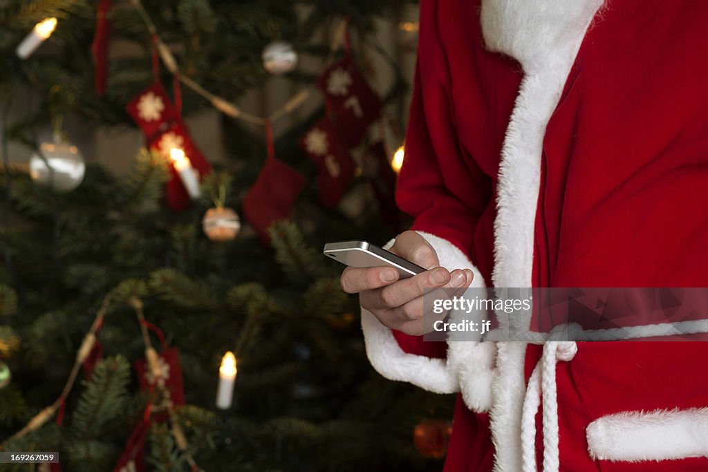 Santa Using Phone Santa Claus Using Cell Phone High-Res Stock Photo - Getty Images