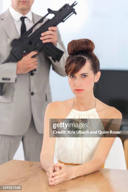 woman and boyfriend with machine gun - machinery guarding stock pictures, royalty-free photos & images