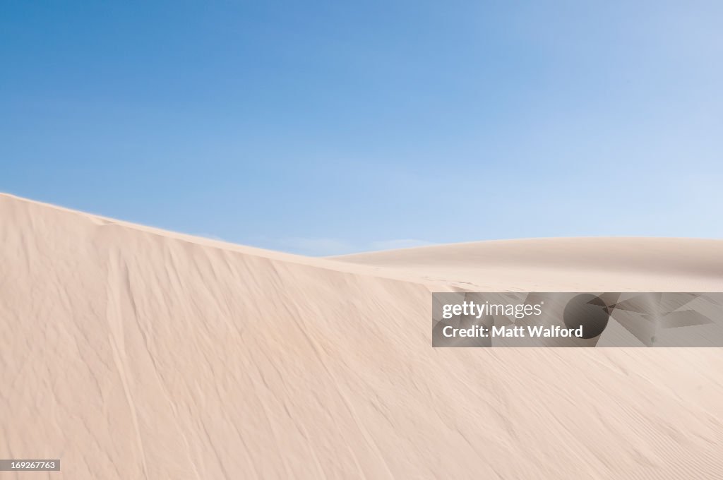 Sand dunes in desert landscape