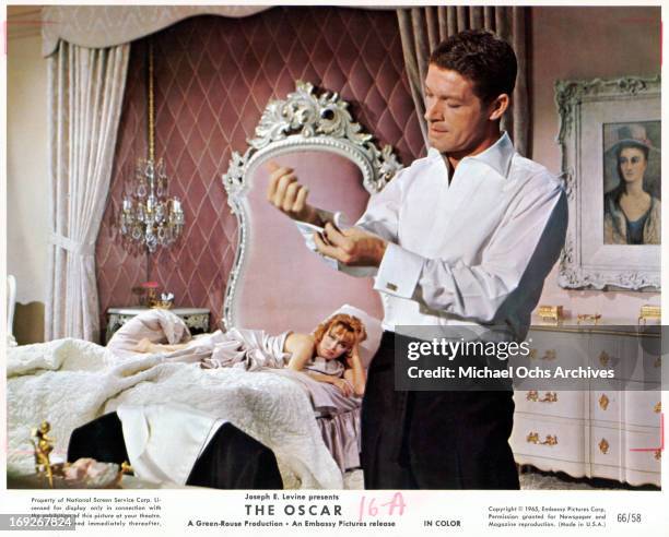 Eleanor Parker watches Stephen Boyd get dressed in a scene from the film 'The Oscar', 1966.