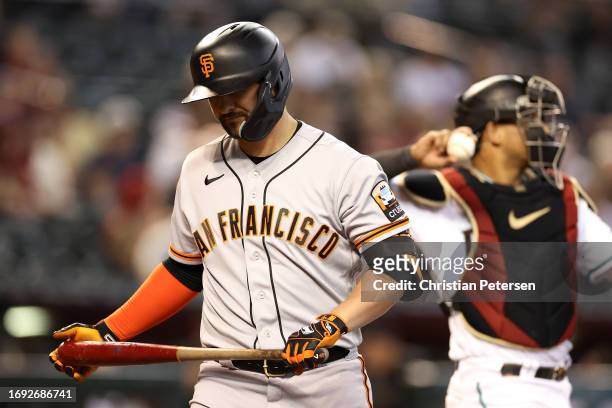 Davis of the San Francisco Giants reacts after striking out against the Arizona Diamondbacks during the third inning of the MLB game at Chase Field...