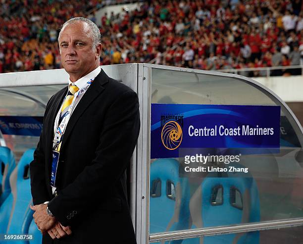 Team Coach Graham Arnold of Central Coast Mariners looks on during the AFC Champions League knockout round match between Guangzhou Evergrande and...