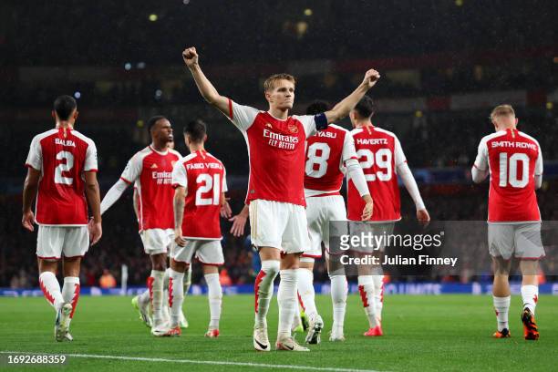 Martin Oedegaard of Arsenal celebrates after scoring the team's fourth goal during the UEFA Champions League match between Arsenal FC and PSV...