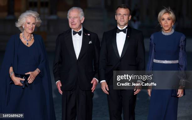 Queen Camilla, King Charles III, President of France Emmanuel Macron and Brigitte Macron arrive ahead of a state dinner at the Chateau de Versailles...