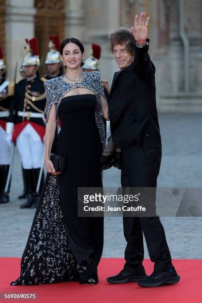 Melanie Hamrick and Mick Jagger arrive ahead of a state dinner at the Chateau de Versailles on September 20, 2023 in Versailles, France. The King and...