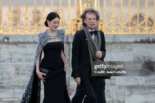 Melanie Hamrick and Mick Jagger arrive ahead of a state dinner at the Chateau de Versailles on September 20, 2023 in Versailles, France. The King and...