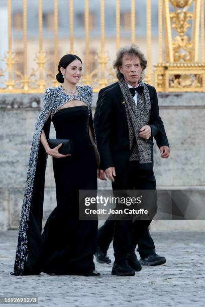 Melanie Hamrick and Mick Jagger arrive ahead of a state dinner at the Chateau de Versailles on September 20, 2023 in Versailles, France. The King and...