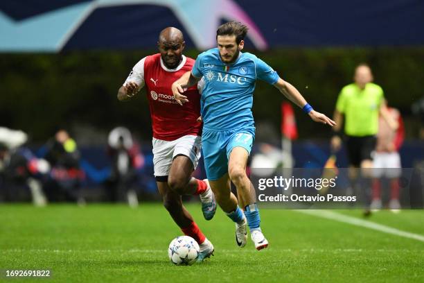 Ali Elmusrati of SC Braga and Khvicha Kvaratskhelia of Napoli battle for possession during the UEFA Champions League match between SC Braga and SSC...