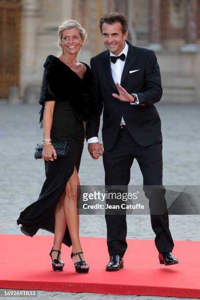 Chloe Bollore and Yannick Bollore arrive ahead of a state dinner at the Chateau de Versailles on September 20, 2023 in Versailles, France. The King...