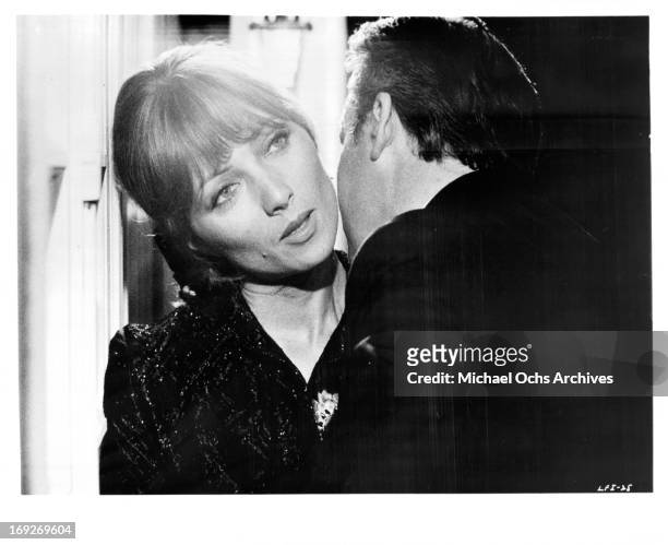 Stephane Audran is admired by man in a scene from the film 'The Unfaithful Wife', 1969.