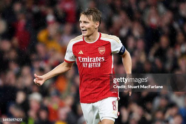 Martin Oedegaard of Arsenal celebrates after scoring the team's fourth goal during the UEFA Champions League match between Arsenal FC and PSV...