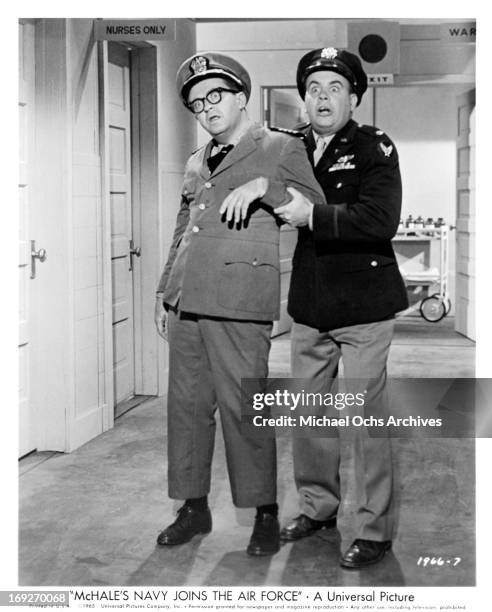 Joe Flynn is aided by a frantic Tim Conway in a scene from the film 'McHale's Navy Joins The Air Force', 1965.