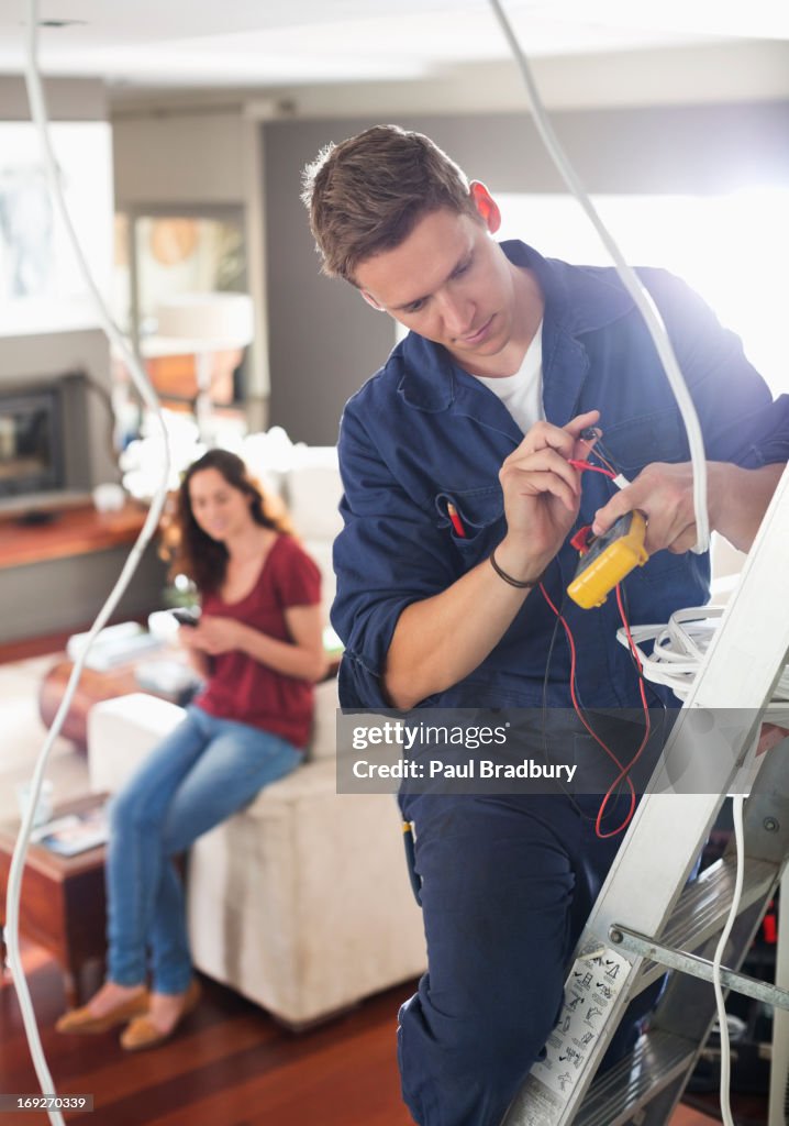 Electrician working in home