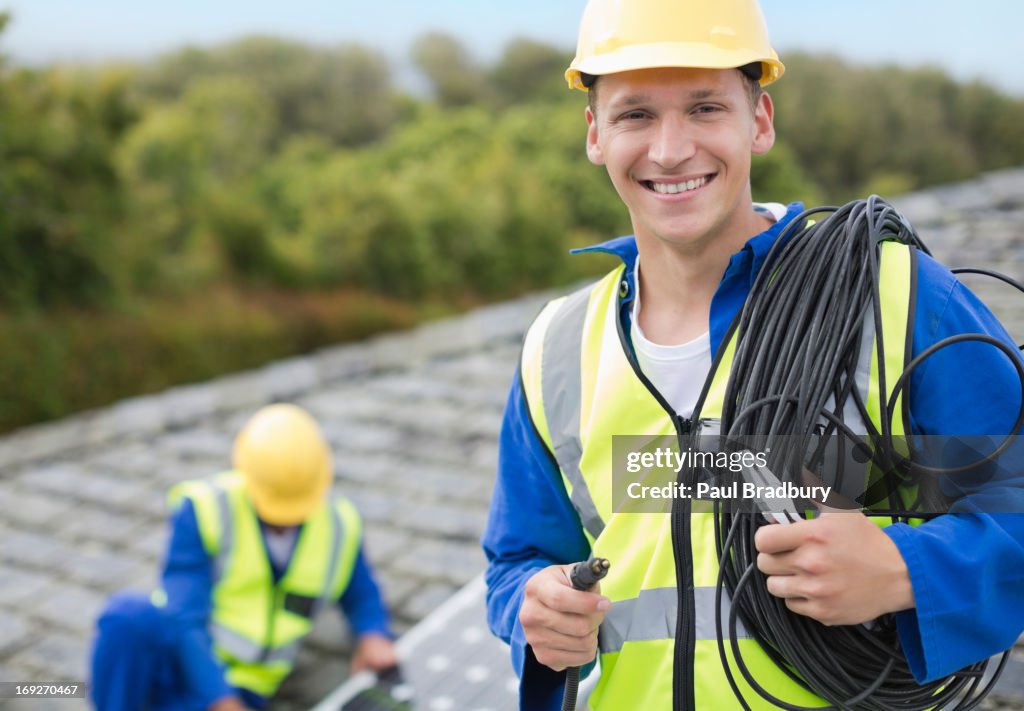Worker smiling on rooftop