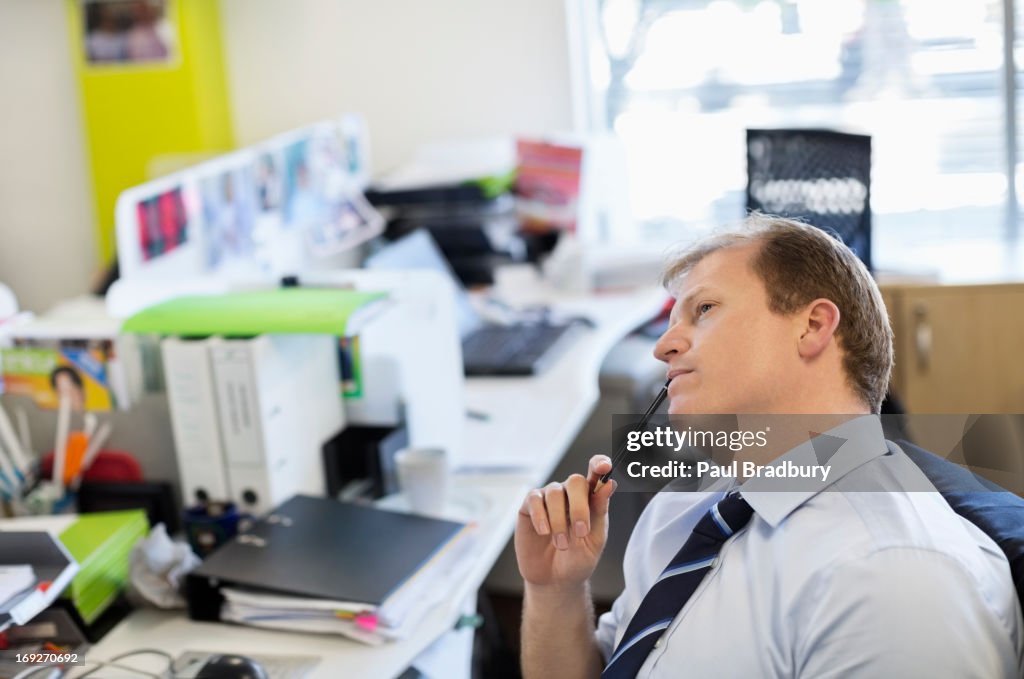 Businessman thinking at desk