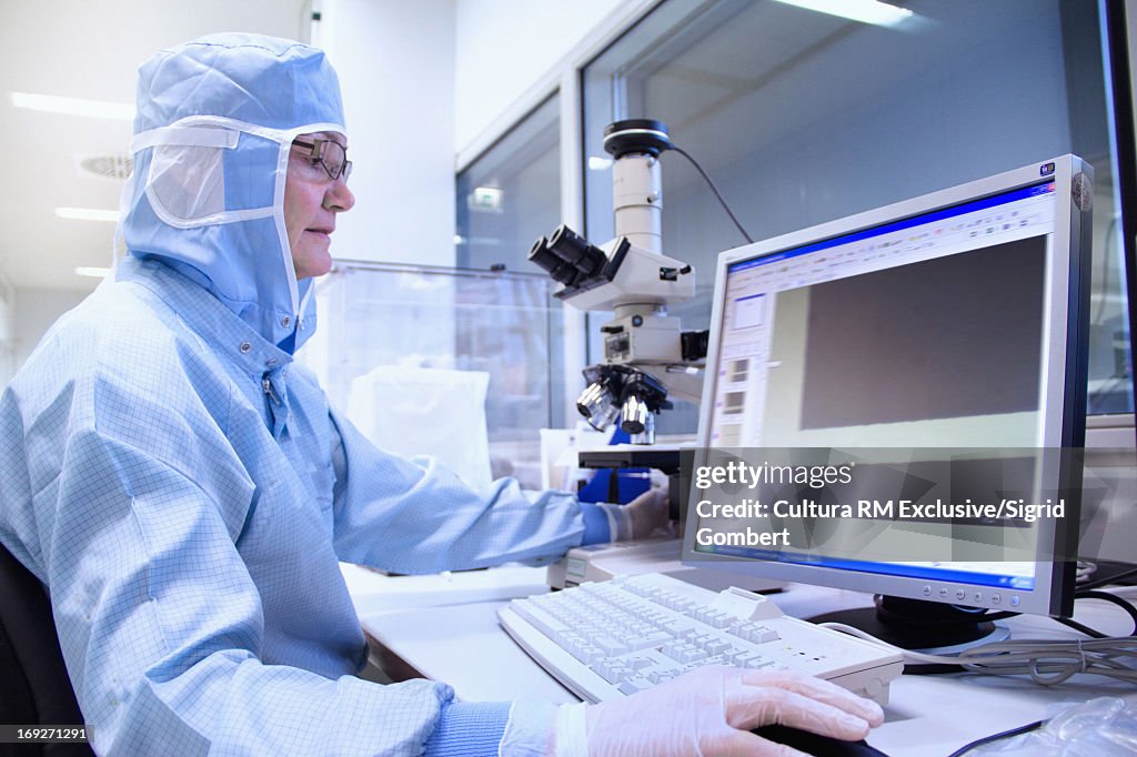 Scientist using computer in lab