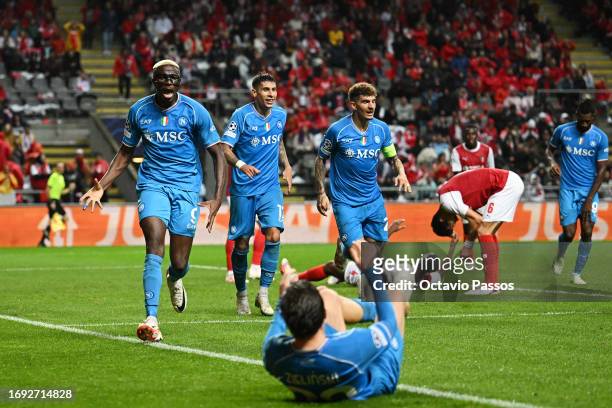 Victor Osimhen of Napoli celebrates the teams second goal with teammates, an own goal scored by Sikou Niakate of SC Braga during the UEFA Champions...