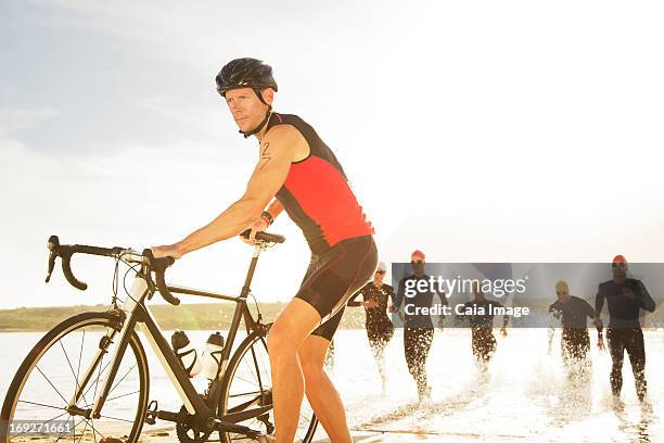 triathletes emerging from water - will cape town run out of water stock pictures, royalty-free photos & images