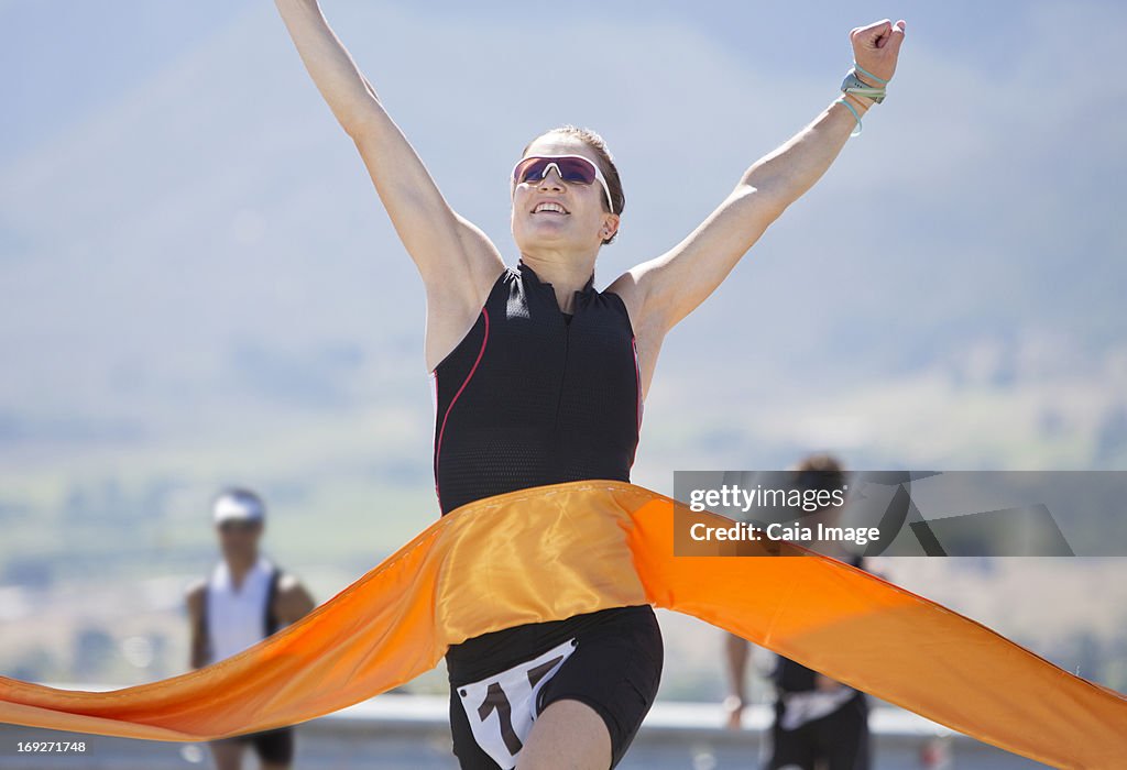 Runner crossing race finish line