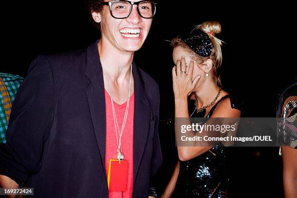 young man laughing as friend covers face - discomfiting stock pictures, royalty-free photos & images
