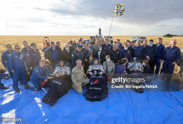 In this handout provided by NASA, Expedition 69 NASA astronaut Frank Rubio , Roscosmos cosmonauts Sergey Prokopyev and Dmitri Petelin sit in chairs...