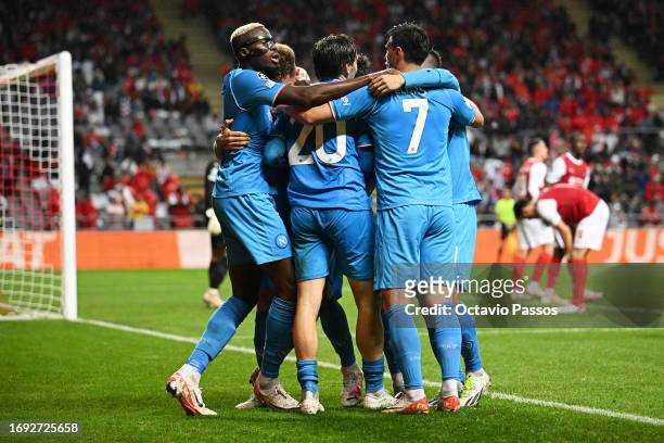 Piotr Zielinski and Eljif Elmas of Napoli celebrate the teams second goal with teammates, an own goal scored by Sikou Niakate of SC Braga during the...