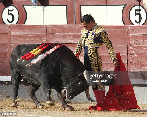 Spanish matador Ivan Fandino makes a pass to a bull at Las Ventas bullring during the San Isidro Feria on May 22, 2013 in Madrid. AFP PHOTO / ALBERTO...