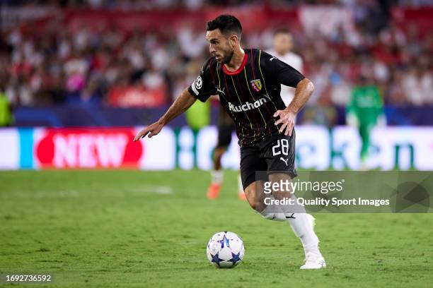 Adrien Thomasson of RC Lens runs with the ball during the UEFA Champions League match between Sevilla FC and RC Lens at Estadio Ramon Sanchez Pizjuan...