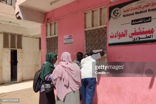 Patients wait at a hospital amid the spread of cholera and dengue fever cases, in Gedaref city on September 27, 2023.