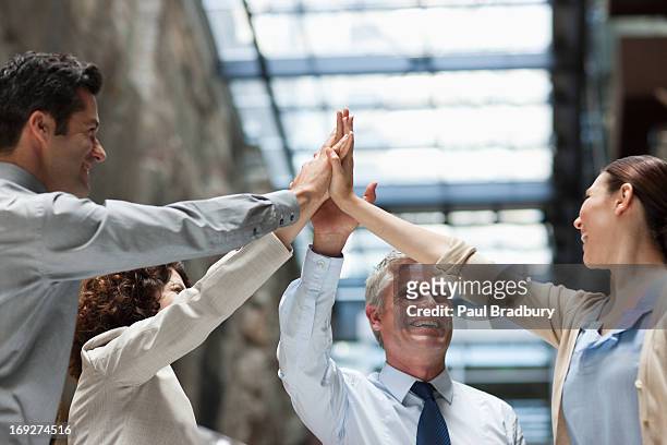 business people with hands together - business relationship stock pictures, royalty-free photos & images
