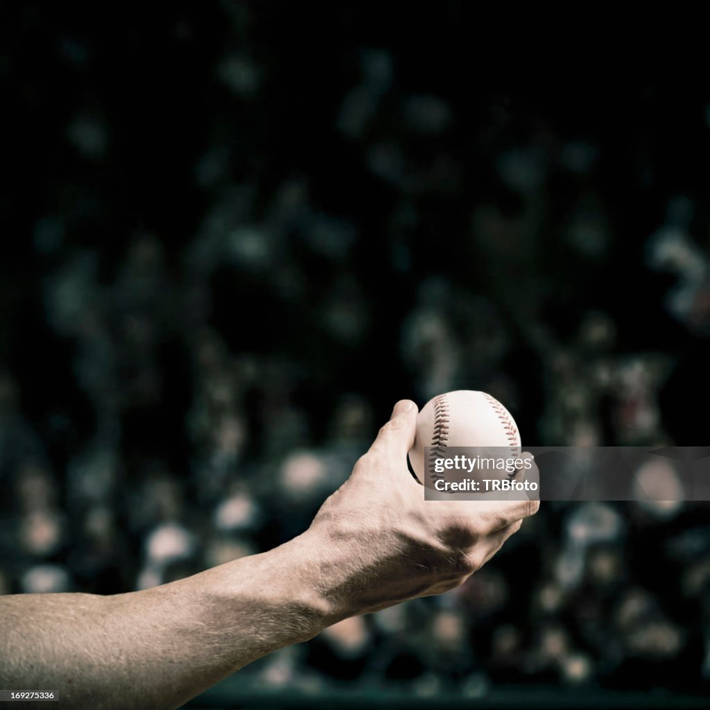 Caucasian baseball player holding ball