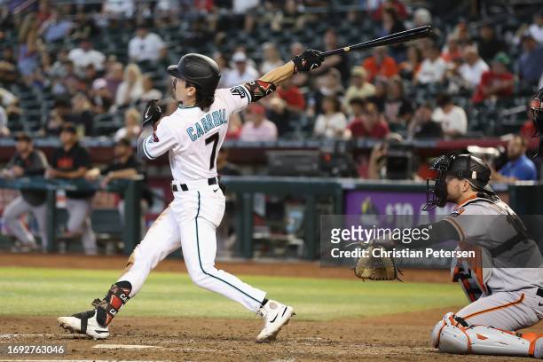 Corbin Carroll of the Arizona Diamondbacks hits a solo home run against the San Francisco Giants during the seventh inning of the MLB game at Chase...