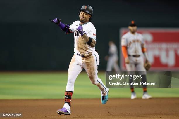 Ketel Marte of the Arizona Diamondbacks reacts after hitting a solo home run against the San Francisco Giants during the seventh inning of the MLB...