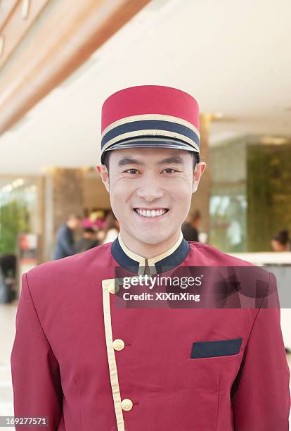 portrait of bellhop - door attendant stock pictures, royalty-free photos & images