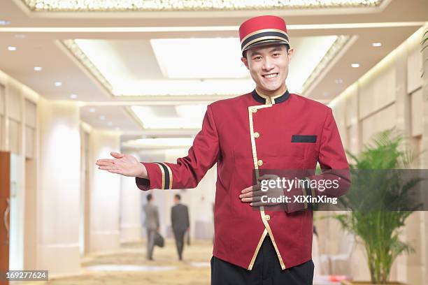 portrait of bellhop, greeting - bellhop stock pictures, royalty-free photos & images