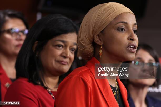 Deputy Chair of the Congressional Progressive Caucus Rep. Ilhan Omar speaks as Chair of the Congressional Progressive Caucus Rep. Pramila Jayapal...