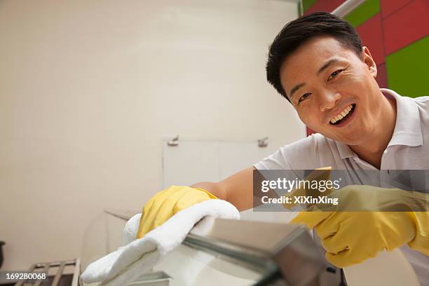 cafeteria worker cleaning food serving area - school caretaker stock pictures, royalty-free photos & images