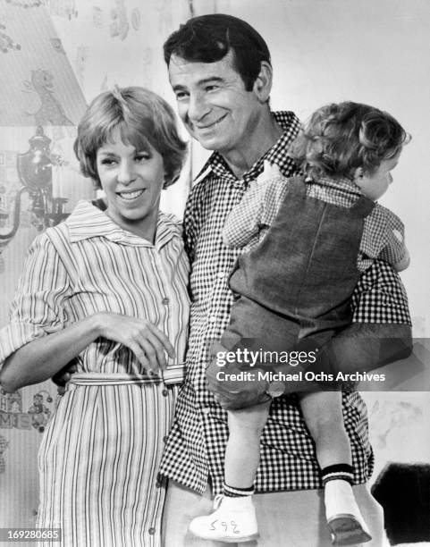 Carol Burnett and Walter Matthau hold their child in a scene from the film 'Pete 'N' Tillie', 1972. (Photo by Universal/Getty Images